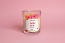 Load image into Gallery viewer, Candle in a glass jar with a label on a pink background